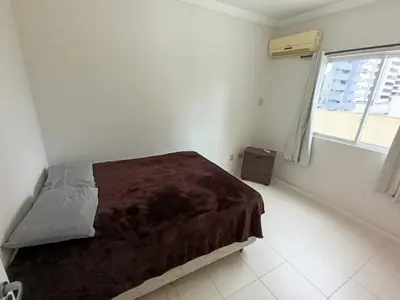 Uma cama ou camas num quarto em Meia Praia Itapema Apartmento até 10 pessoas
