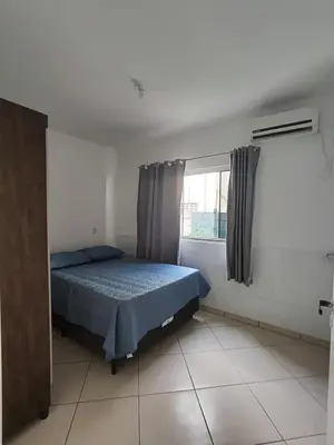 Uma cama ou camas num quarto em Apartamento em Bombinhas