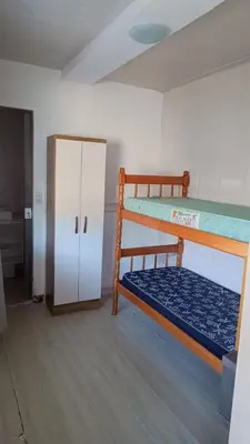 Uma cama ou camas num quarto em Kitnet Container 2