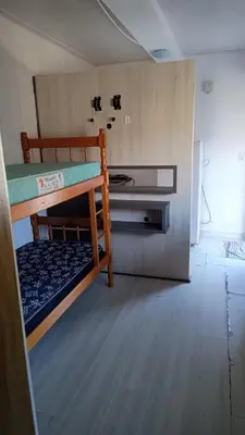 Uma cama ou camas num quarto em Kitnet Container 2