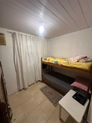 Uma cama ou camas num quarto em Itapema Verão