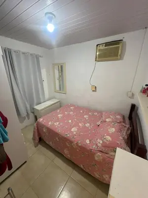 Uma cama ou camas num quarto em Itapema Verão