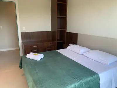 Uma cama ou camas num quarto em Cobertura panorâmica por do sol e jacuzzi