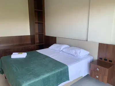 Uma cama ou camas num quarto em Cobertura panorâmica por do sol e jacuzzi