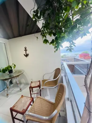 Uma área de estar em Apartamento quadra mar no centro de Itapema