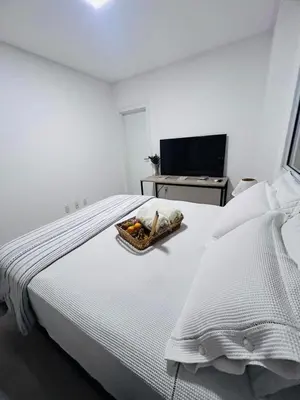 Uma cama ou camas num quarto em Apartamento 03 dormitório em Porto belo