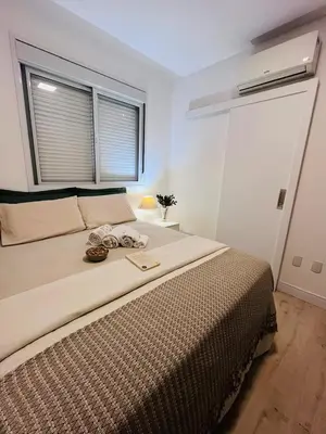 Uma cama ou camas num quarto em Apartamento 03 dormitório em Porto belo