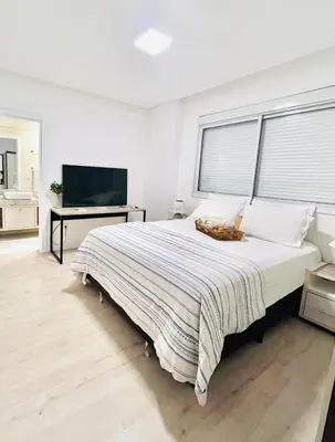 Uma cama ou camas num quarto em Apartamento 03 dormitório em Porto belo