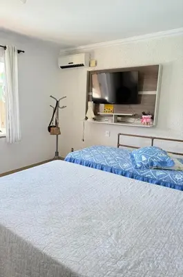 Uma cama ou camas num quarto em Casa com piscina Porto Belo