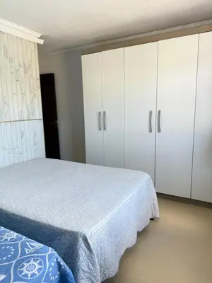 Uma cama ou camas num quarto em Casa com piscina Porto Belo