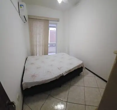 Uma cama ou camas num quarto em Apto 3 quartos á 1 quadra do mar