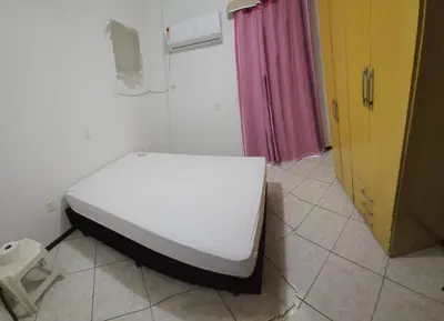 Uma cama ou camas num quarto em Apto 3 quartos á 1 quadra do mar