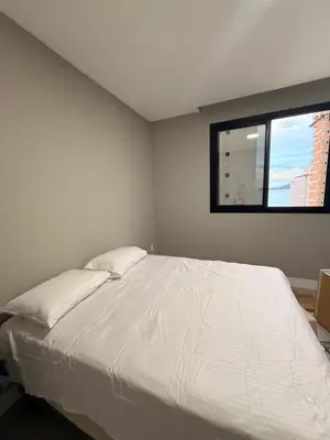 Uma cama ou camas num quarto em Apartamento de Alto Padrão com excelente localização
