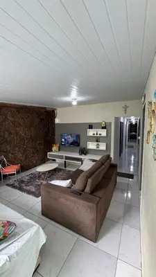 Uma área de estar em Casa temporada , Balneário Perequê