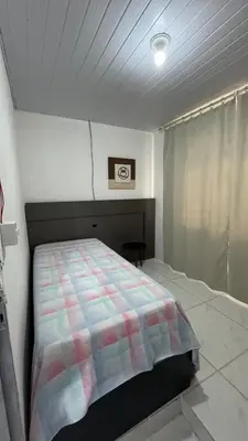 Uma cama ou camas num quarto em Casa temporada , Balneário Perequê