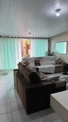 Uma área de estar em Casa temporada , Balneário Perequê