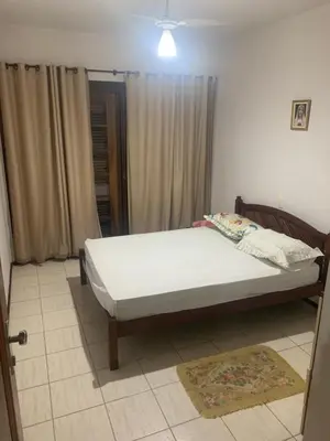 Uma cama ou camas num quarto em Casa frente mar em itapema