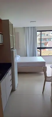 Uma cama ou camas num quarto em Praias de Bombinhas Residencial