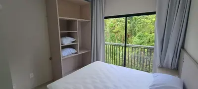 Uma cama ou camas num quarto em Praias de Bombinhas Residencial