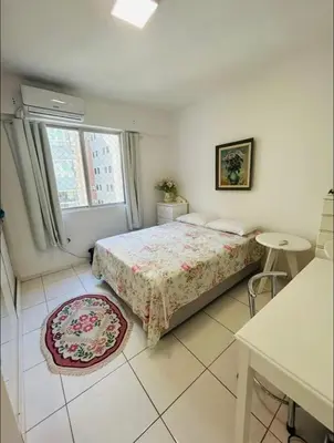 Uma cama ou camas num quarto em Apartamento Quadra Mar BC