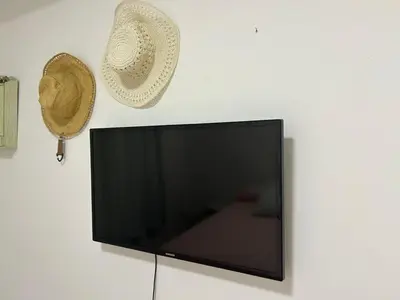 Uma televisão e/ou sistema de entretenimento em Apartamento Quadra Mar BC