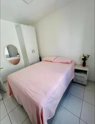 Uma cama ou camas num quarto em Apartamento Quadra Mar BC