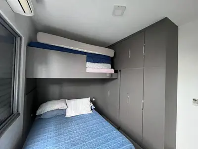 Uma cama ou camas num quarto em casa de Praia Palmas do Arvoredo