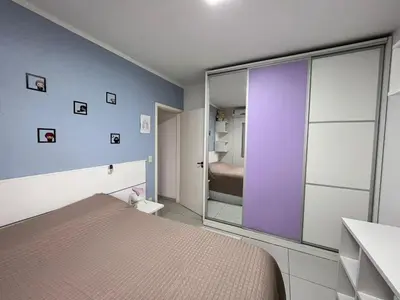 Uma cama ou camas num quarto em casa de Praia Palmas do Arvoredo