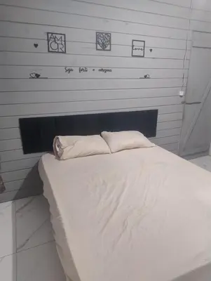 Uma cama ou camas num quarto em Andressa