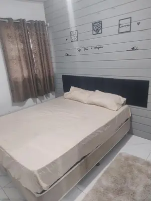 Uma cama ou camas num quarto em Andressa
