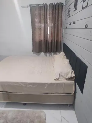 Uma cama ou camas num quarto em Andressa