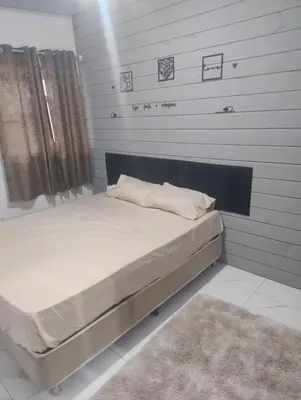 Uma cama ou camas num quarto em Andressa
