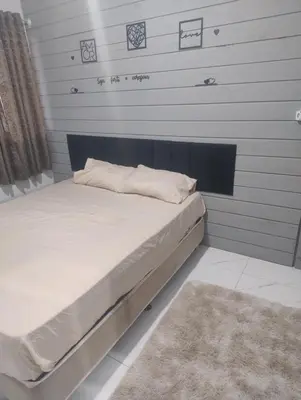 Uma cama ou camas num quarto em Andressa