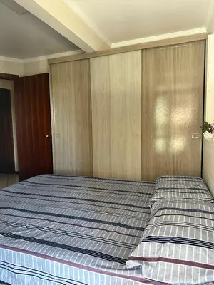 Uma cama ou camas num quarto em Apartamento pé na areia!