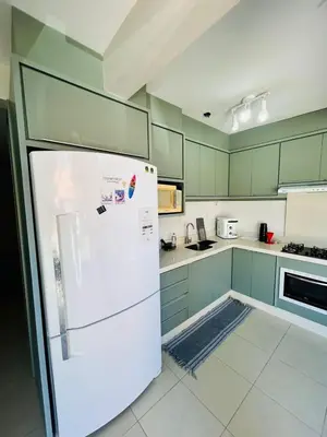 A cozinha ou kitchenette de apartamento Alamandas praia de Palmas