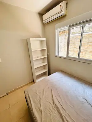 Uma cama ou camas num quarto em apartamento Alamandas praia de Palmas