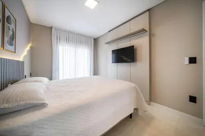 Uma cama ou camas num quarto em Apartamento alto padrão 2 suites c/piscina