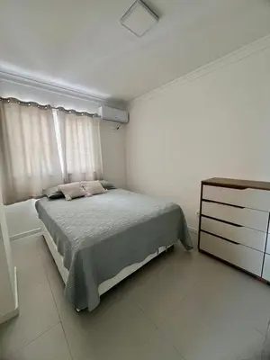 Uma cama ou camas num quarto em Apartamento Rio pequeno Camboriú SC