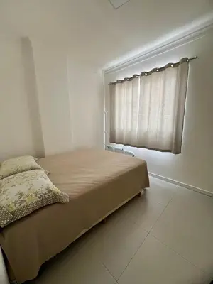 Uma cama ou camas num quarto em Apartamento Rio pequeno Camboriú SC