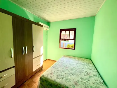 Uma cama ou camas num quarto em Casa Bombinhas - 300m do Mar
