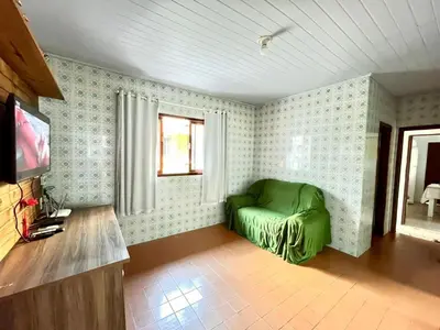 Uma televisão e/ou sistema de entretenimento em Casa Bombinhas - 300m do Mar