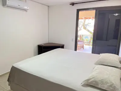 Uma cama ou camas num quarto em Casa Ampla e Completa - 300m do Mar até 8 pessoas