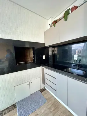 A cozinha ou kitchenette de Apartamento luxuoso Itapema