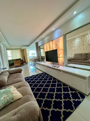 Uma televisão e/ou sistema de entretenimento em Apartamento luxuoso Itapema