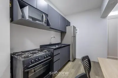A cozinha ou kitchenette de Apto 2 qts 350m da praia no centro BC EAN0104