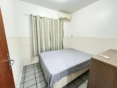 Uma cama ou camas num quarto em Casa completa - 350m da Praia 10 pessoas