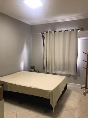 Uma cama ou camas num quarto em Apartamento Centro Meia Praia