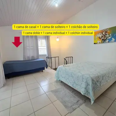Uma cama ou camas num quarto em Praia da Lagoinha - Mar de Dentro - Residencial Pé na areia