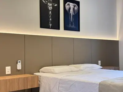 Uma cama ou camas num quarto em Apto Novo ao Lado do Hard Rock - 3 Quartos 2 Vagas