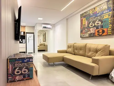 Uma área de estar em Apto Novo ao Lado do Hard Rock - 3 Quartos 2 Vagas